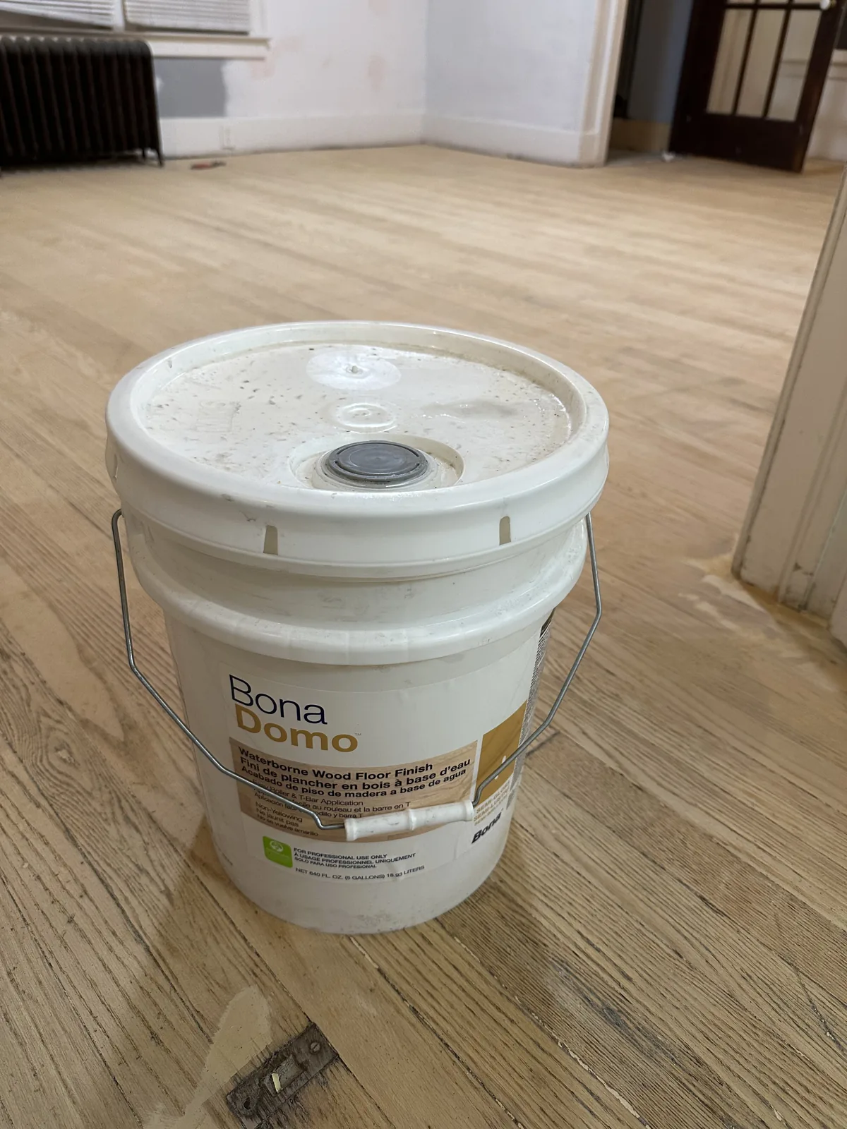 Wood-look flooring install in open room, Plymouth